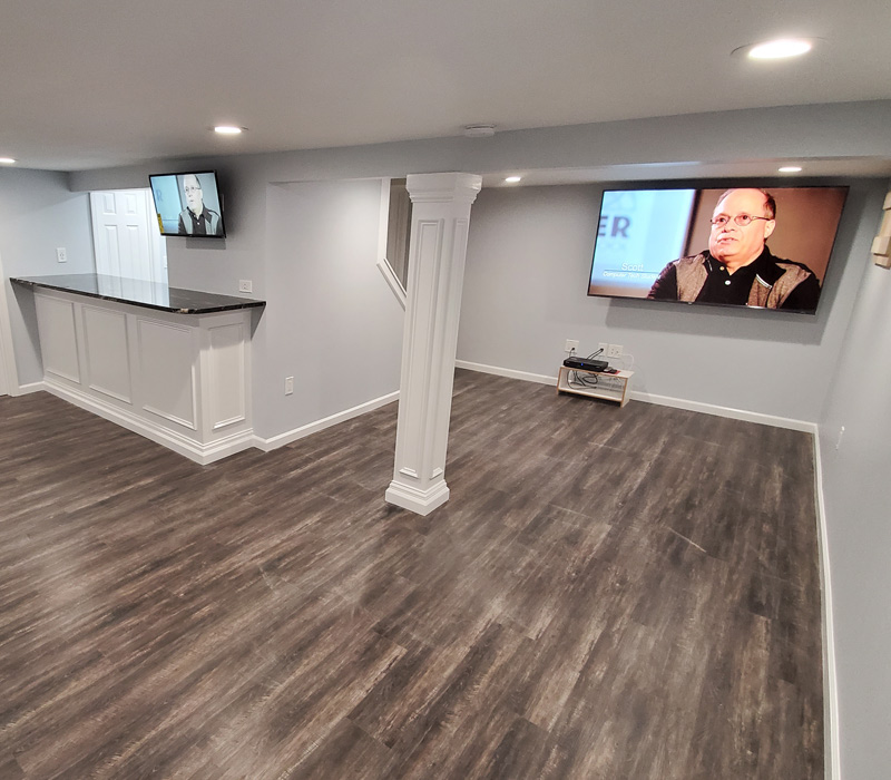 Renovated basement with new flooring in Islip, NY