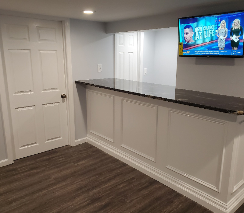 Renovated basement with new flooring in Islip, NY
