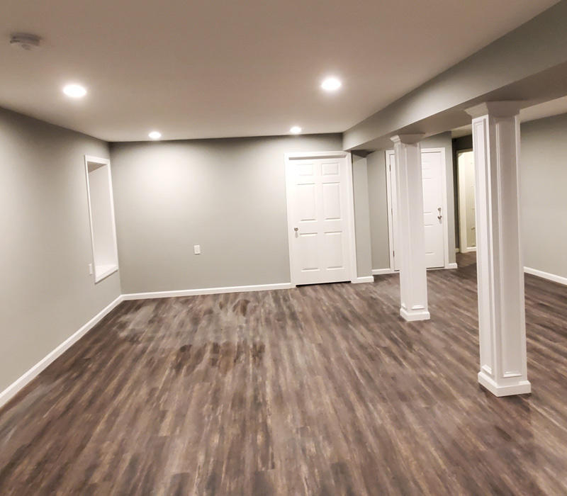 Renovated basement with new flooring and painting in Suffolk County, NY