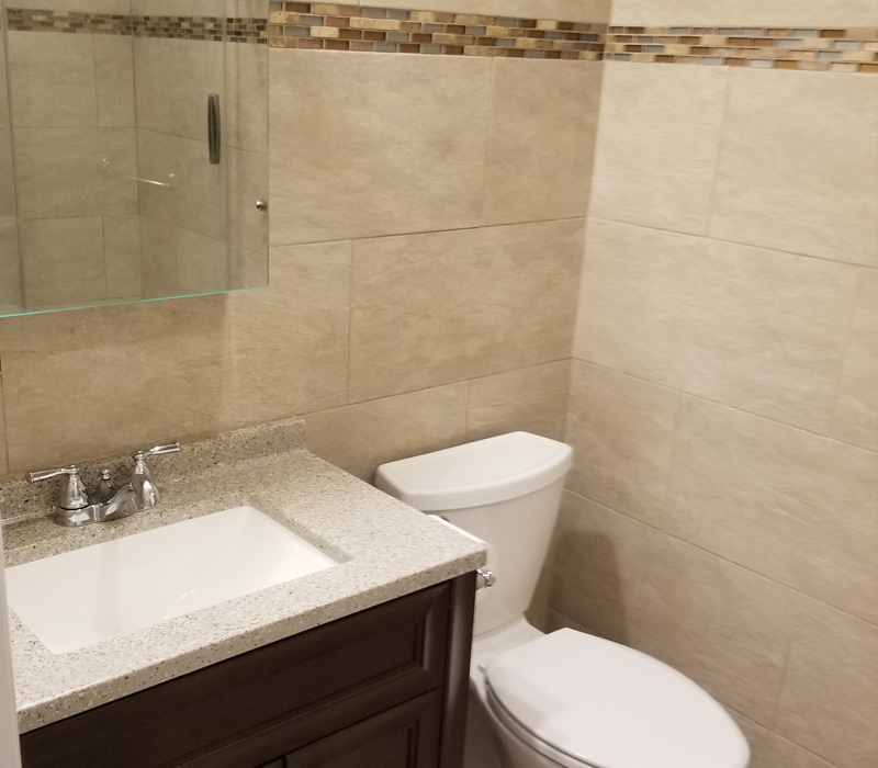 New bathroom tiling and sink in Suffolk County, NY