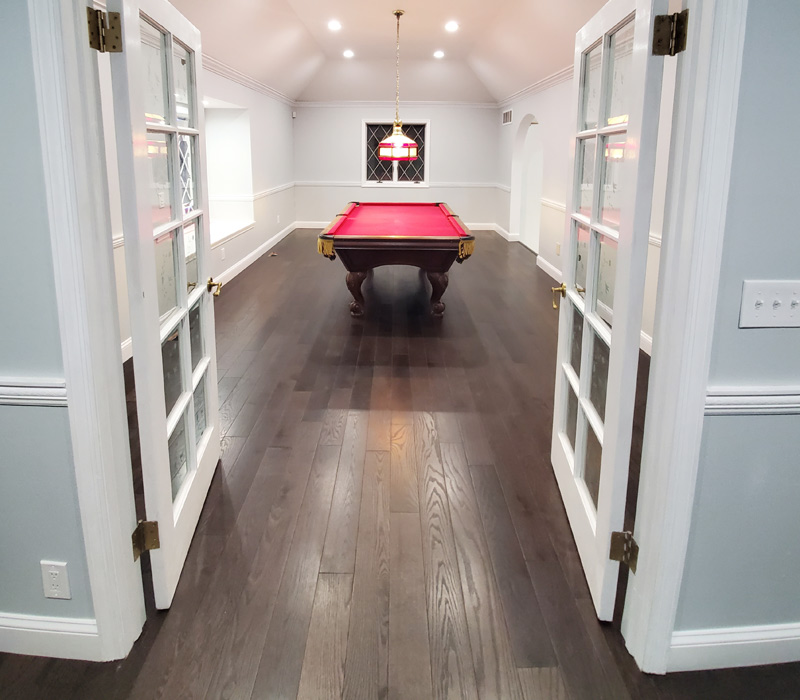 Room with new flooring and painting with pool table