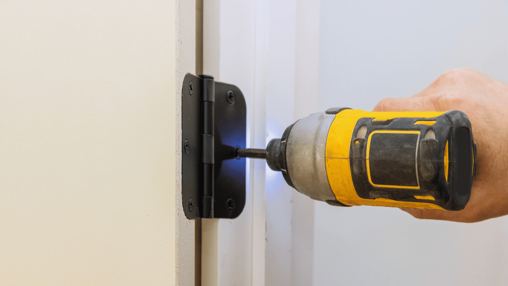 Technician repairing door frame